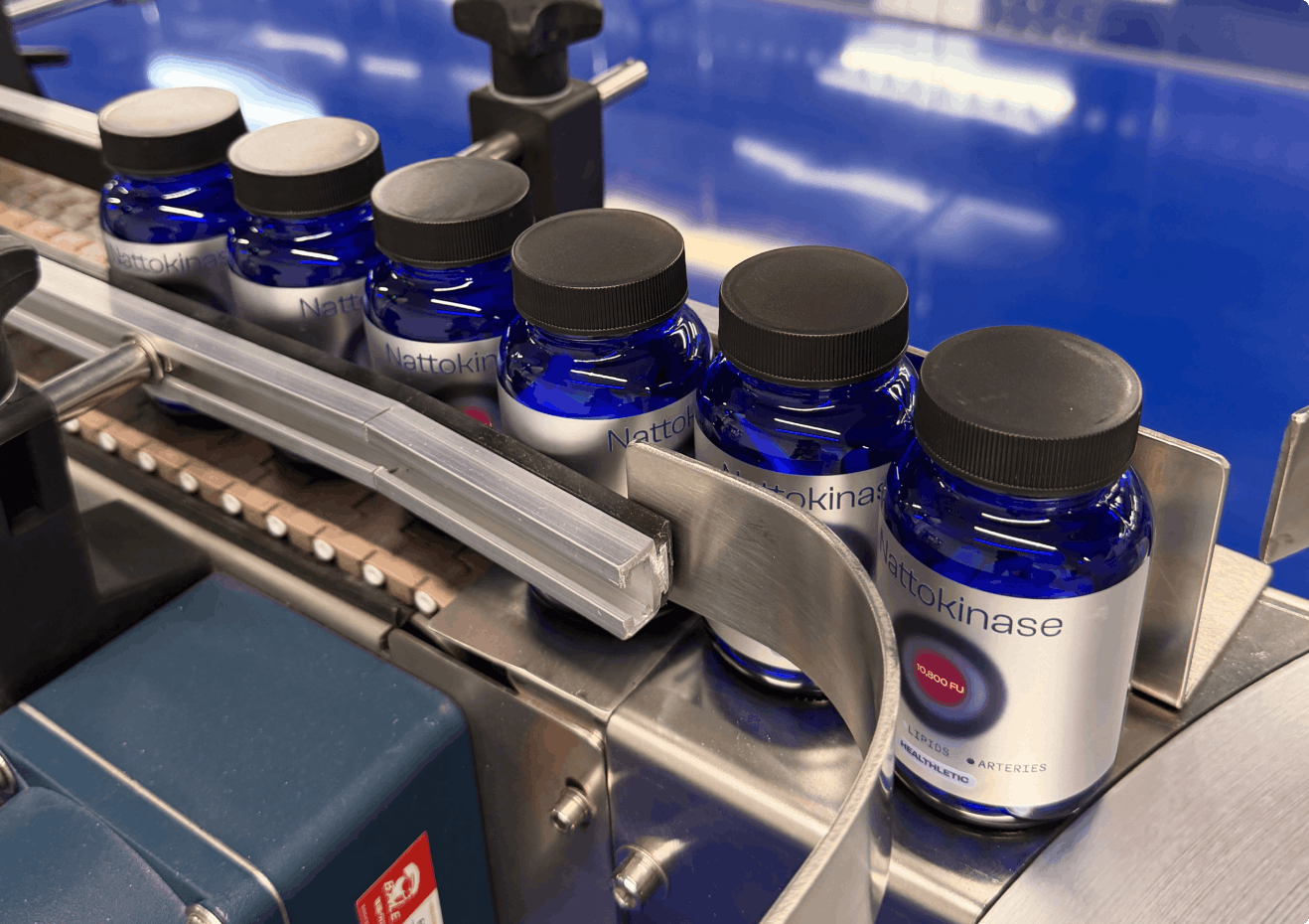 Ultimate Nattokinase bottles on the manufacturing line